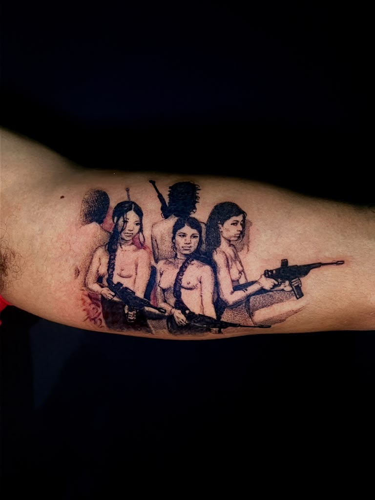 Black and grey realism tattoo of three women holding rifles on forearm by Alison at Inked City Tattoos in Trenton, NJ